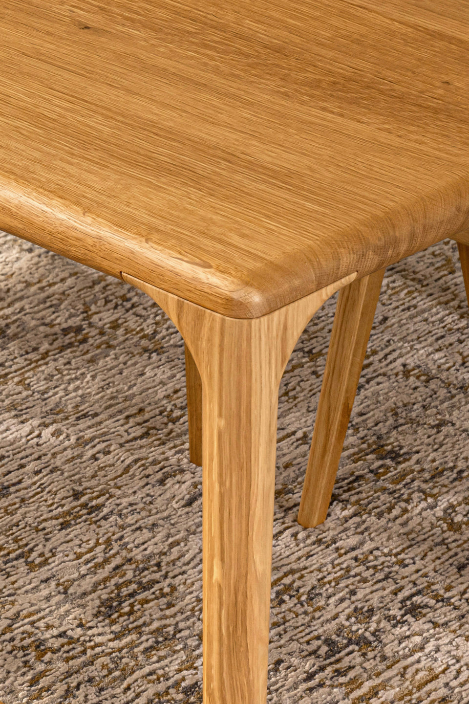 Tapered solid wood legs, reinforced with steel.