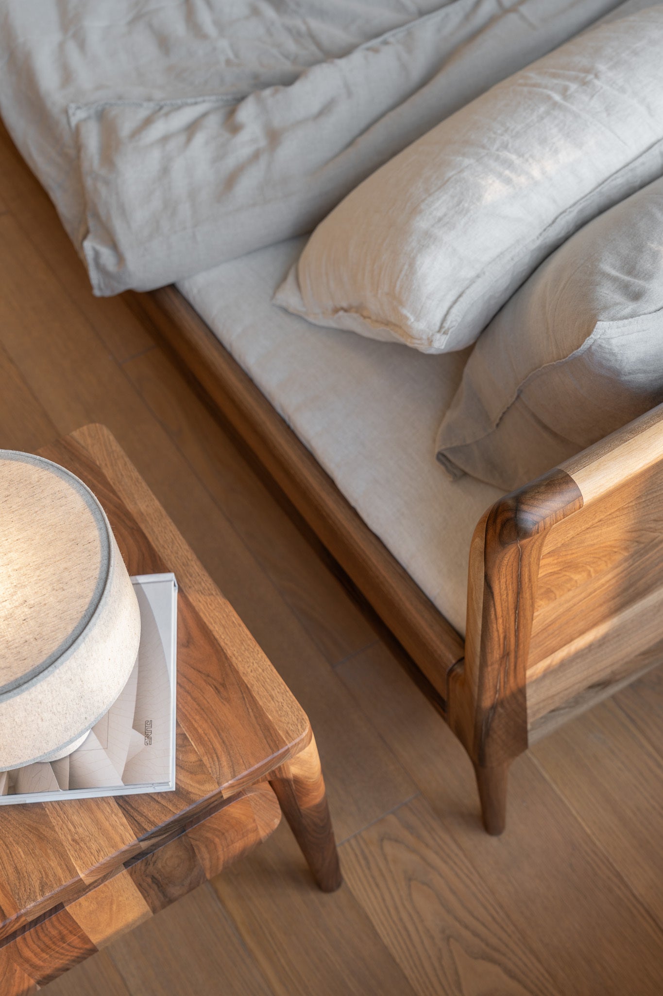 Curved headboard designed for ergonomic comfort.